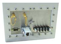 A removable I/O plate populated with a filtered DB9, an RJ-45 filter module, two SMA bulkheads and a row of banana jacks