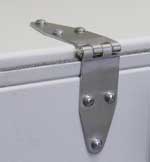 Close-up of an oversized stainless steel hinge mounted on the back edge of a test enclosure lid